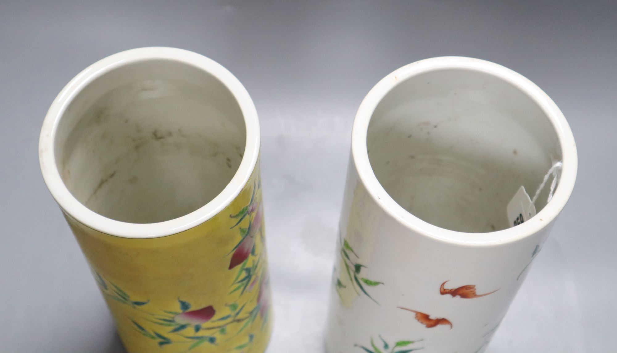Two Chinese peaches and bats famille rose cylindrical vases, height 29cm